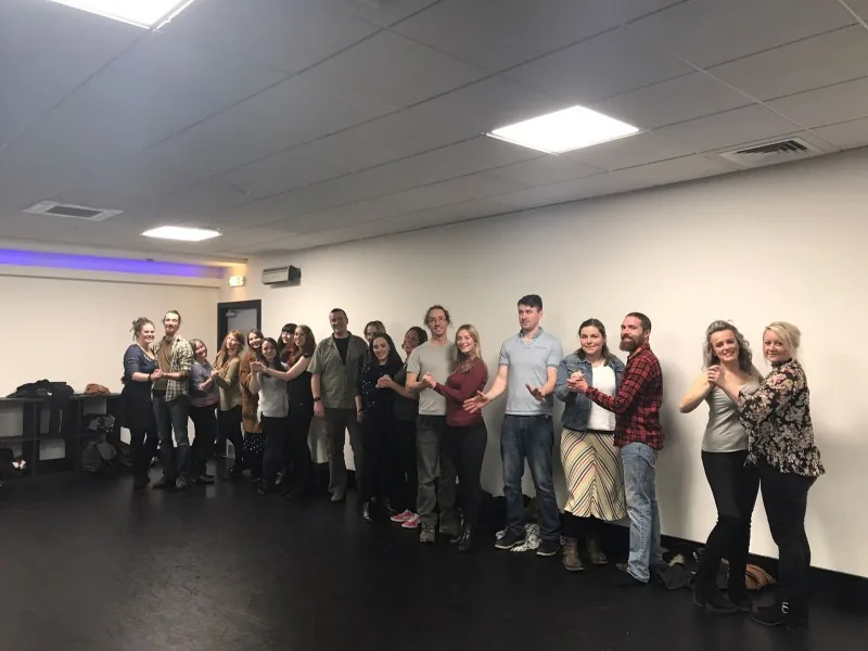 Hen party learning a ballroom hold in a hired room